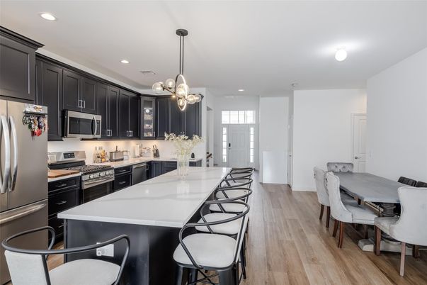 Dining room, Interior, Kitchen, Pendant Lights, Recessed Lighting, Stainless Steel Appliances, Wood Texture Flooring