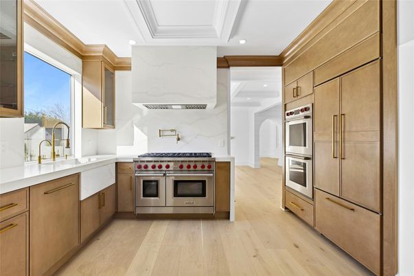 Interior, Kitchen, Marble Walls, Recessed Lighting, Stainless Steel Appliances, Wood Texture Flooring