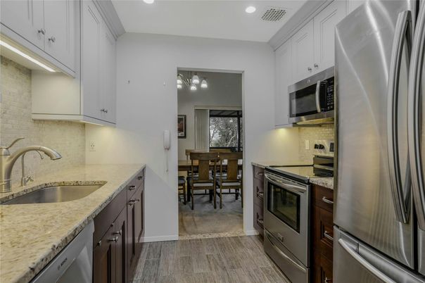 Dining room, Interior, Kitchen, Recessed Lighting, Stainless Steel Appliances, Wood Texture Flooring