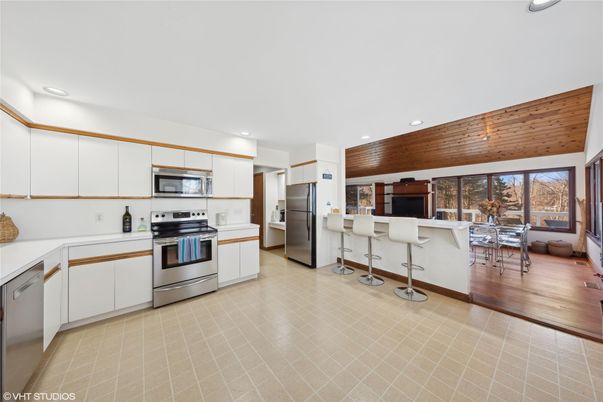 Dining room, Interior, Kitchen, Recessed Lighting, Stainless Steel Appliances, Wood Texture Flooring