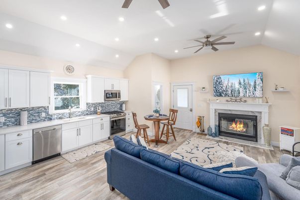 Dining room, Fireplace, Interior, Kitchen, Living room, Recessed Lighting, Stainless Steel Appliances, Wood Texture Flooring