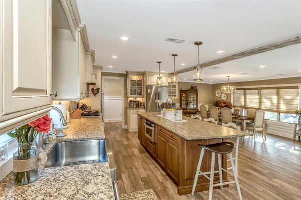 Chandelier, Dining room, Interior, Kitchen, Pendant Lights, Recessed Lighting, Stainless Steel Appliances, Wood Texture Flooring