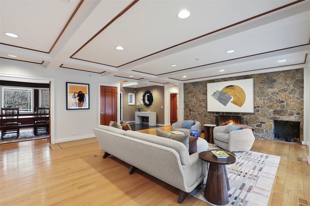 Dining room, Fireplace, Interior, Living room, Recessed Lighting, Stone Walls, Wood Texture Flooring