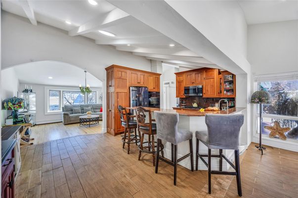 Dining room, Interior, Kitchen, Pendant Lights, Recessed Lighting, Stainless Steel Appliances, Wood Texture Flooring