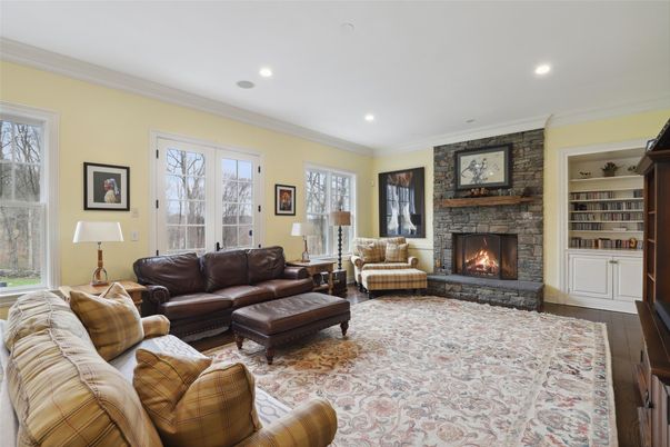 Fireplace, Interior, Living room, Recessed Lighting, Stone Walls, Wood Texture Flooring