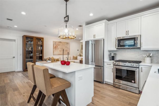 Chandelier, Dining room, Interior, Kitchen, Pendant Lights, Recessed Lighting, Stainless Steel Appliances, Wood Texture Flooring