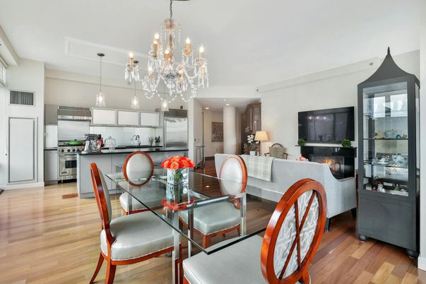 Chandelier, Dining room, Interior, Kitchen, Living room, Pendant Lights, Recessed Lighting, Stainless Steel Appliances, Wood Texture Flooring