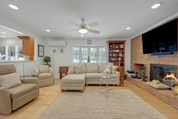 Fireplace, Interior, Living room, Recessed Lighting, Stone Walls, Wood Texture Flooring