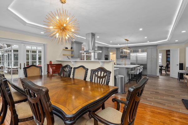 Chandelier, Dining room, Interior, Kitchen, Pendant Lights, Recessed Lighting, Stainless Steel Appliances, Wood Texture Flooring