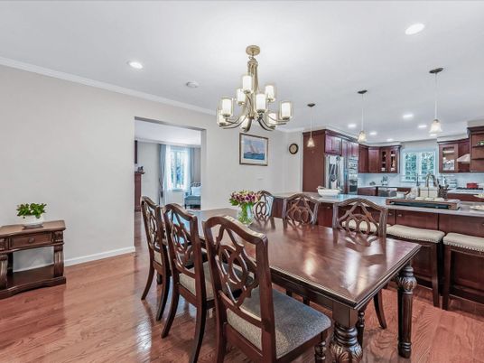 Chandelier, Dining room, Interior, Kitchen, Pendant Lights, Recessed Lighting, Stainless Steel Appliances, Wood Texture Flooring
