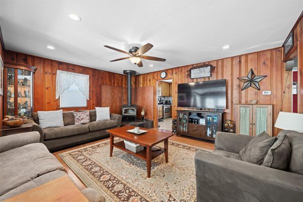 Fireplace, Interior, Living room, Recessed Lighting, Wood Texture Flooring, Wooden Walls