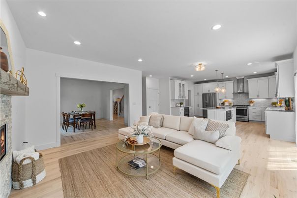 Dining room, Fireplace, Interior, Kitchen, Living room, Pendant Lights, Recessed Lighting, Stainless Steel Appliances, Wood Texture Flooring