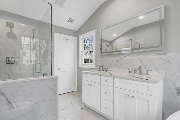 Bathroom, Dual Sink Vanities, Glass Shower, Interior, Marble, Marble Walls, Recessed Lighting