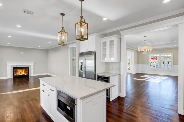 Chandelier, Fireplace, Interior, Kitchen, Pendant Lights, Recessed Lighting, Stainless Steel Appliances, Wood Texture Flooring