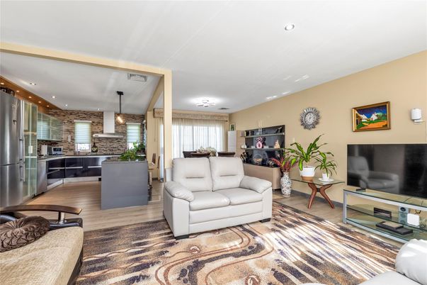 Interior, Kitchen, Living room, Pendant Lights, Recessed Lighting, Stainless Steel Appliances, Stone Walls, Wood Texture Flooring