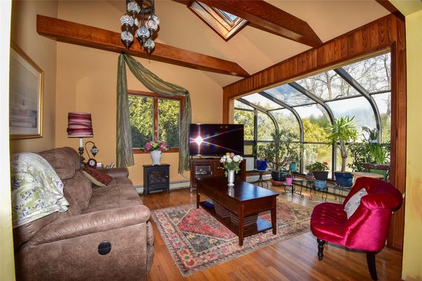 Fireplace, Glass Ceilings, Interior, Living room, Sun Room, Wooden Beams, Wood Texture Flooring