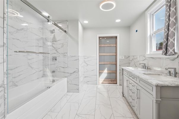 Bathroom, Dual Sink Vanities, Glass Shower, Interior, Marble, Marble Walls, Recessed Lighting