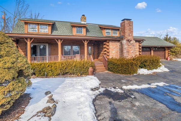 Exterior, Facade, Brick Facade, Log Home