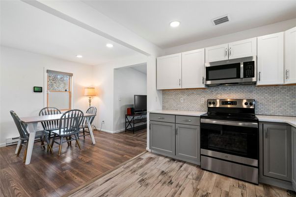 Dining room, Interior, Kitchen, Recessed Lighting, Stainless Steel Appliances, Wood Texture Flooring