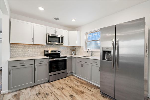 Interior, Kitchen, Recessed Lighting, Stainless Steel Appliances, Wood Texture Flooring