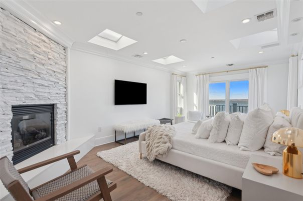 Bedroom, Fireplace, Interior, Recessed Lighting, Stone Walls, Wood Texture Flooring