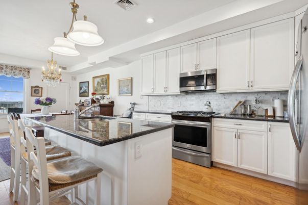 Chandelier, Dining room, Interior, Kitchen, Recessed Lighting, Stainless Steel Appliances, Wood Texture Flooring