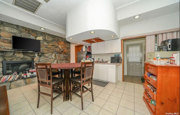 Dining room, Fireplace, Interior, Kitchen, Recessed Lighting, Stone Walls