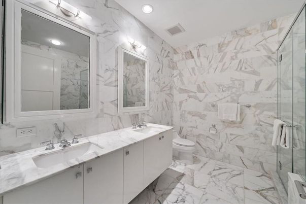 Bathroom, Dual Sink Vanities, Glass Shower, Interior, Marble, Marble Walls, Recessed Lighting