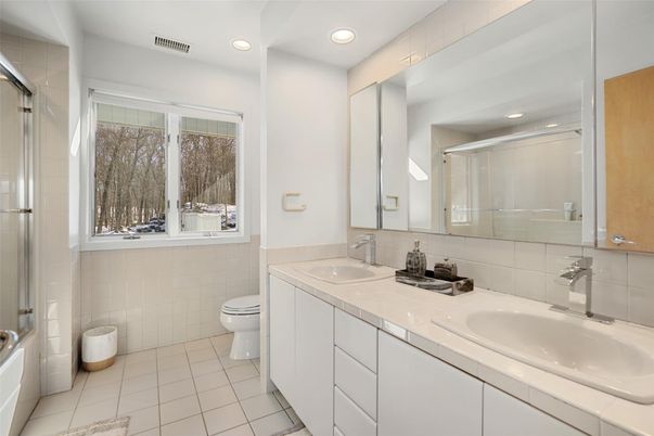 Bathroom, Dual Sink Vanities, Glass Shower, Interior, Recessed Lighting, Tile Countertops