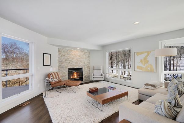 Fireplace, Interior, Living room, Recessed Lighting, Stone Walls, Wood Texture Flooring