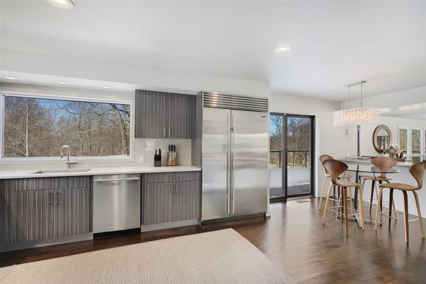 Chandelier, Dining room, Interior, Kitchen, Recessed Lighting, Stainless Steel Appliances, Wood Texture Flooring