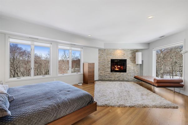 Bedroom, Fireplace, Interior, Recessed Lighting, Stone Walls, Wood Texture Flooring