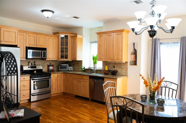 Chandelier, Dining room, Interior, Kitchen, Stainless Steel Appliances, Wood Texture Flooring