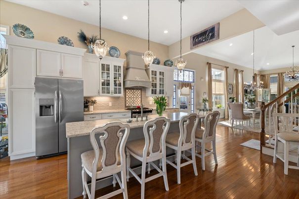Chandelier, Dining room, Interior, Kitchen, Pendant Lights, Recessed Lighting, Stainless Steel Appliances, Wood Texture Flooring