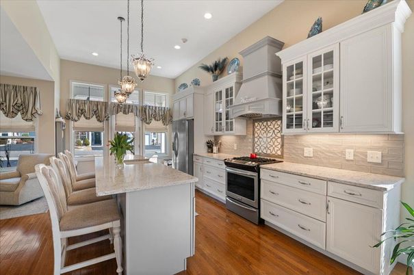 Chandelier, Dining room, Interior, Kitchen, Pendant Lights, Recessed Lighting, Stainless Steel Appliances, Wood Texture Flooring