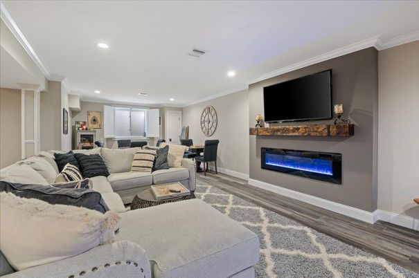 Dining room, Fireplace, Interior, Living room, Recessed Lighting, Wood Texture Flooring