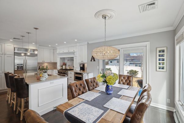 Chandelier, Dining room, Interior, Kitchen, Pendant Lights, Recessed Lighting, Stainless Steel Appliances, Wood Texture Flooring