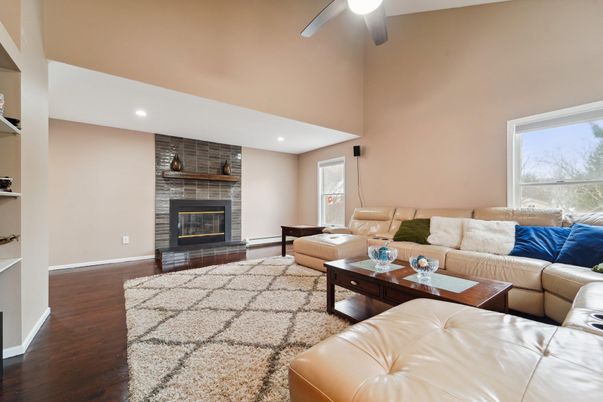 Fireplace, Interior, Living room, Recessed Lighting, Stone Walls, Wood Texture Flooring