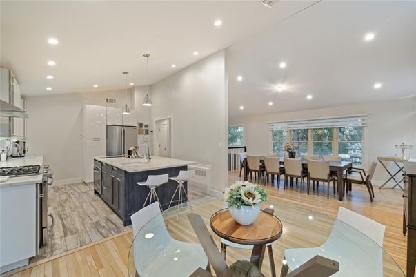 Dining room, Interior, Kitchen, Pendant Lights, Recessed Lighting, Stainless Steel Appliances, Wood Texture Flooring
