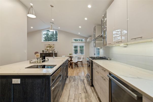 Dining room, Interior, Kitchen, Pendant Lights, Recessed Lighting, Stainless Steel Appliances, Wood Texture Flooring