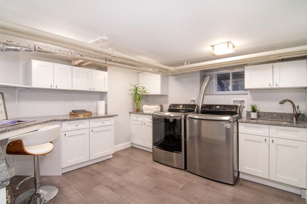 Interior, Kitchen, Recessed Lighting, Washer, Wood Texture Flooring