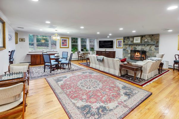 Chandelier, Dining room, Fireplace, Interior, Living room, Recessed Lighting, Stone Walls, Wood Texture Flooring