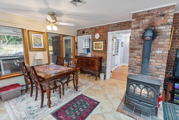 Dining room, Fireplace, Interior, Stone Walls, Wood Texture Flooring