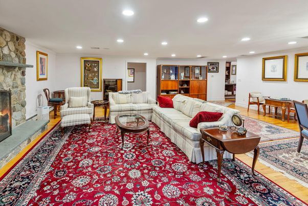 Fireplace, Interior, Living room, Recessed Lighting, Stone Walls, Wood Texture Flooring