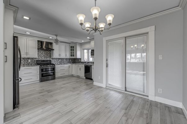 Chandelier, Interior, Kitchen, Recessed Lighting, Stainless Steel Appliances, Wood Texture Flooring