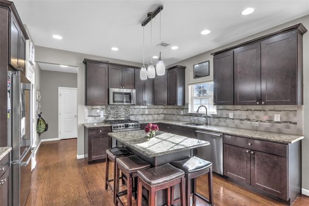 Dining room, Interior, Kitchen, Pendant Lights, Recessed Lighting, Stainless Steel Appliances, Wood Texture Flooring