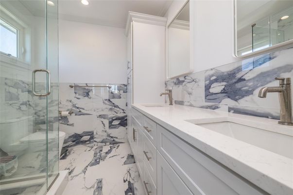 Bathroom, Dual Sink Vanities, Glass Shower, Interior, Marble, Marble Walls, Recessed Lighting