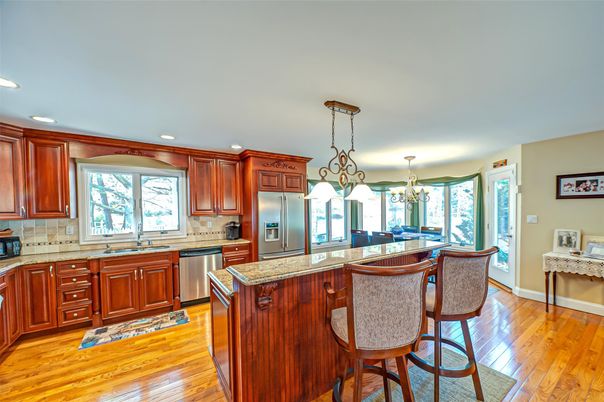 Chandelier, Dining room, Interior, Kitchen, Pendant Lights, Recessed Lighting, Stainless Steel Appliances, Wood Texture Flooring