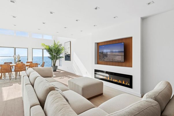 Dining room, Fireplace, Interior, Living room, Recessed Lighting, Water, Wood Texture Flooring