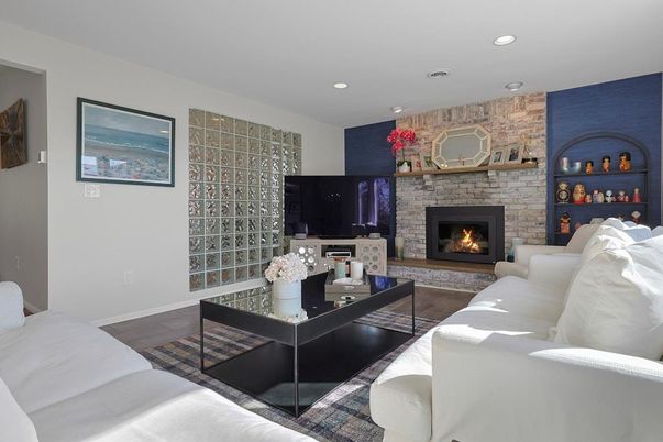 Fireplace, Interior, Living room, Recessed Lighting, Stone Walls, Wood Texture Flooring